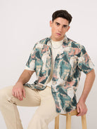 A man wearing a geometric patterned stylish Rayon Resort Shirt and beige trouser