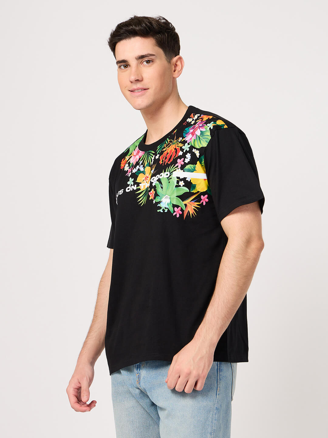 man wearing black floral printed t shirt from thrust.club