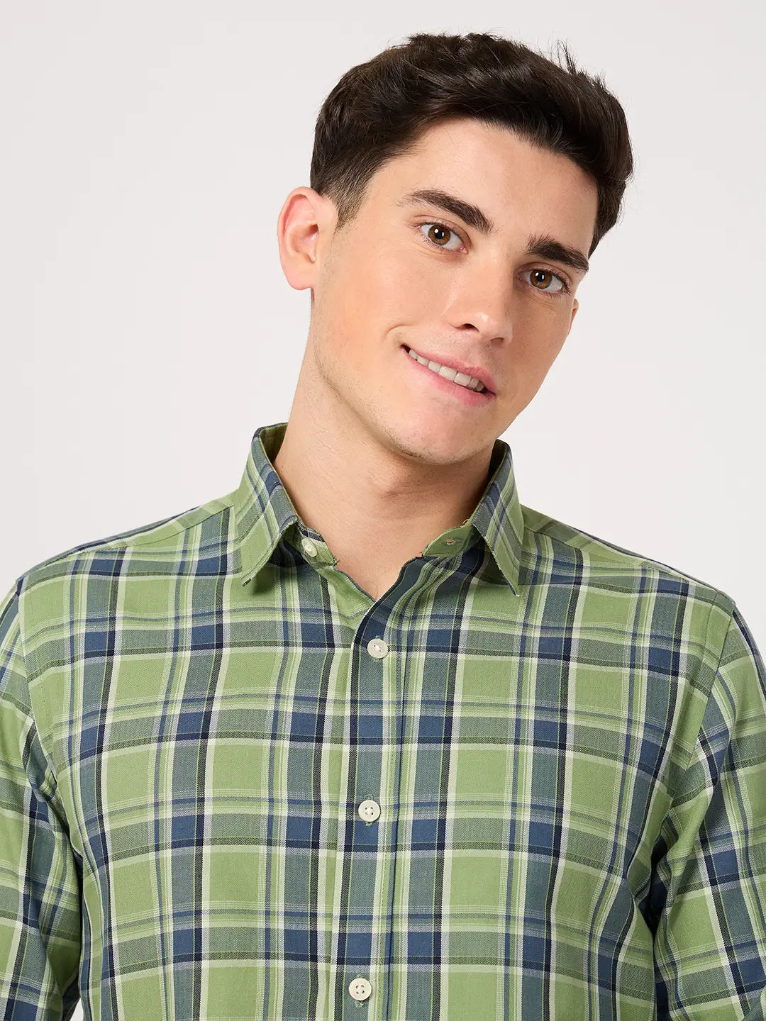 Man wearing a twill cotton green check shirt plaid shirt