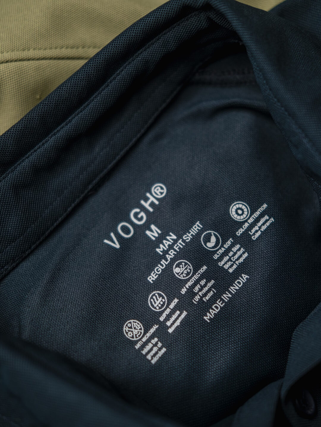 Close-up of a black shirt with VOGH branding