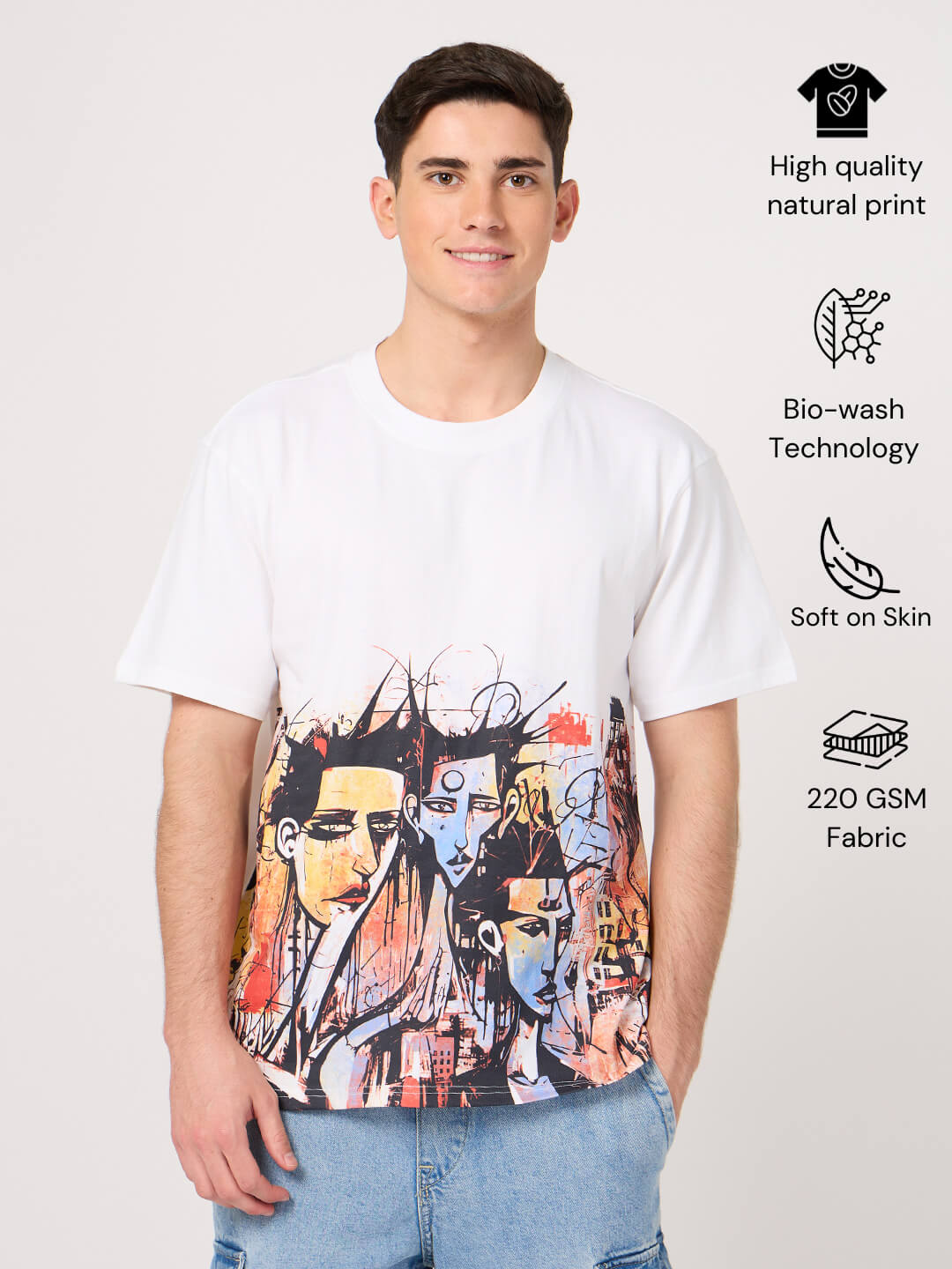 Person wearing a white t-shirt with a colorful printed graphic design