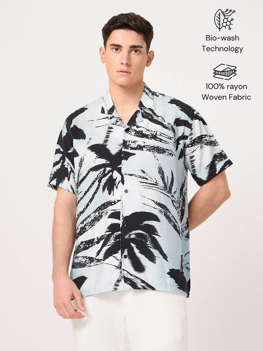 Man wearing a black and white patterned resort shirt