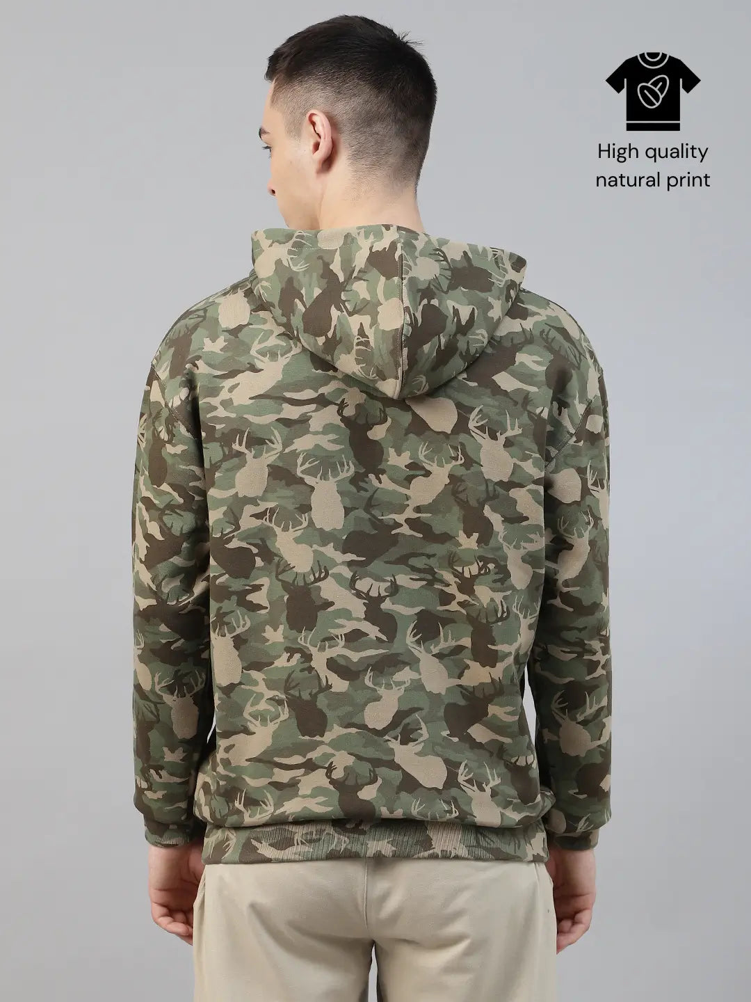 Person wearing a camouflage army print hoodie