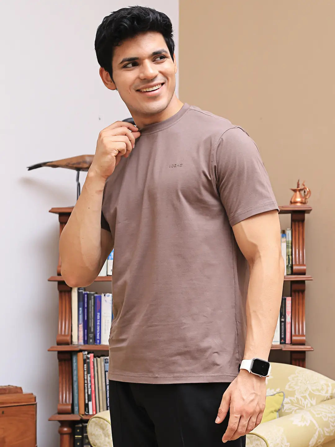 Man wearing a brown crew neck t-shirt made with bio-wash cotton fabric