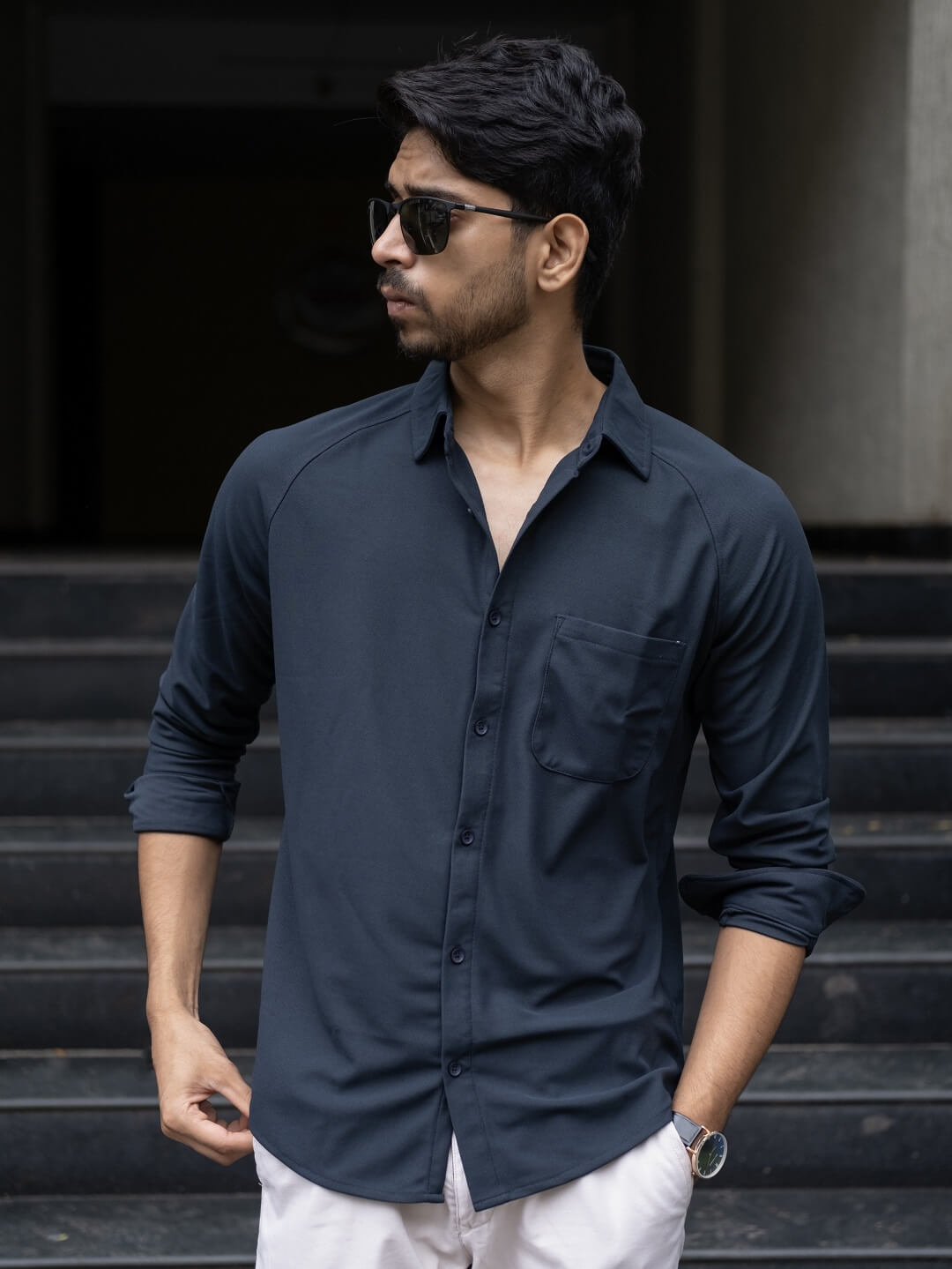 Man wearing a black blue solid shirt