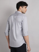 Man wearing a light gray shirt