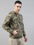 Person wearing a camouflage army print hoodie