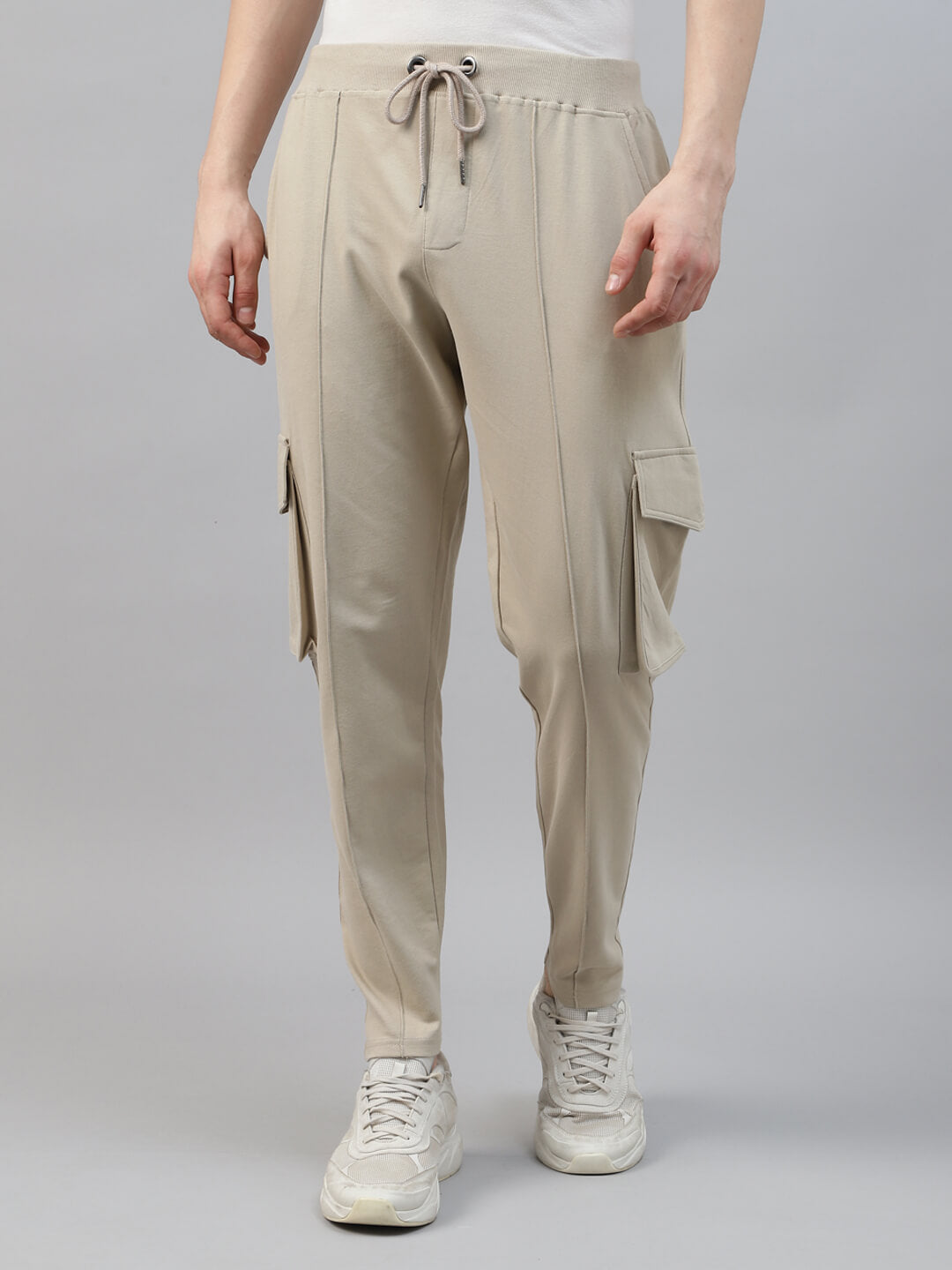 Beige cargo jogger pants worn by a person