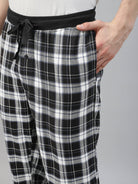 Black and white check pattern jogger pants with a drawstring