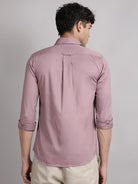 Man wearing solid satin shirt