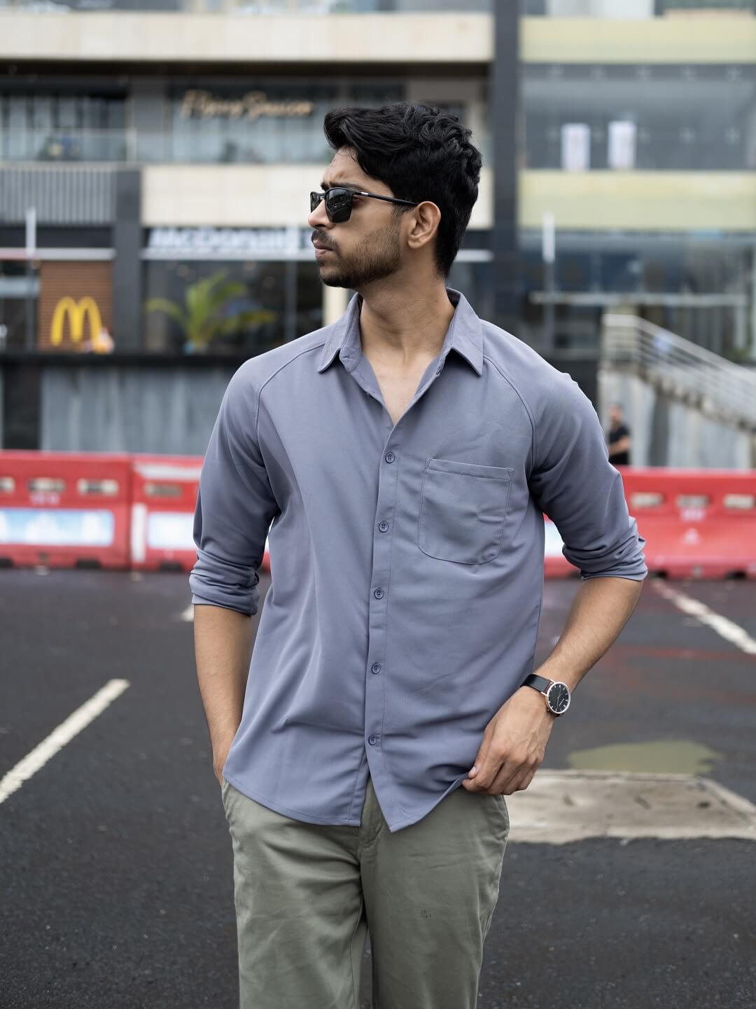 Man wearing a plain gray shirt
