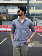 Man wearing a plain gray shirt