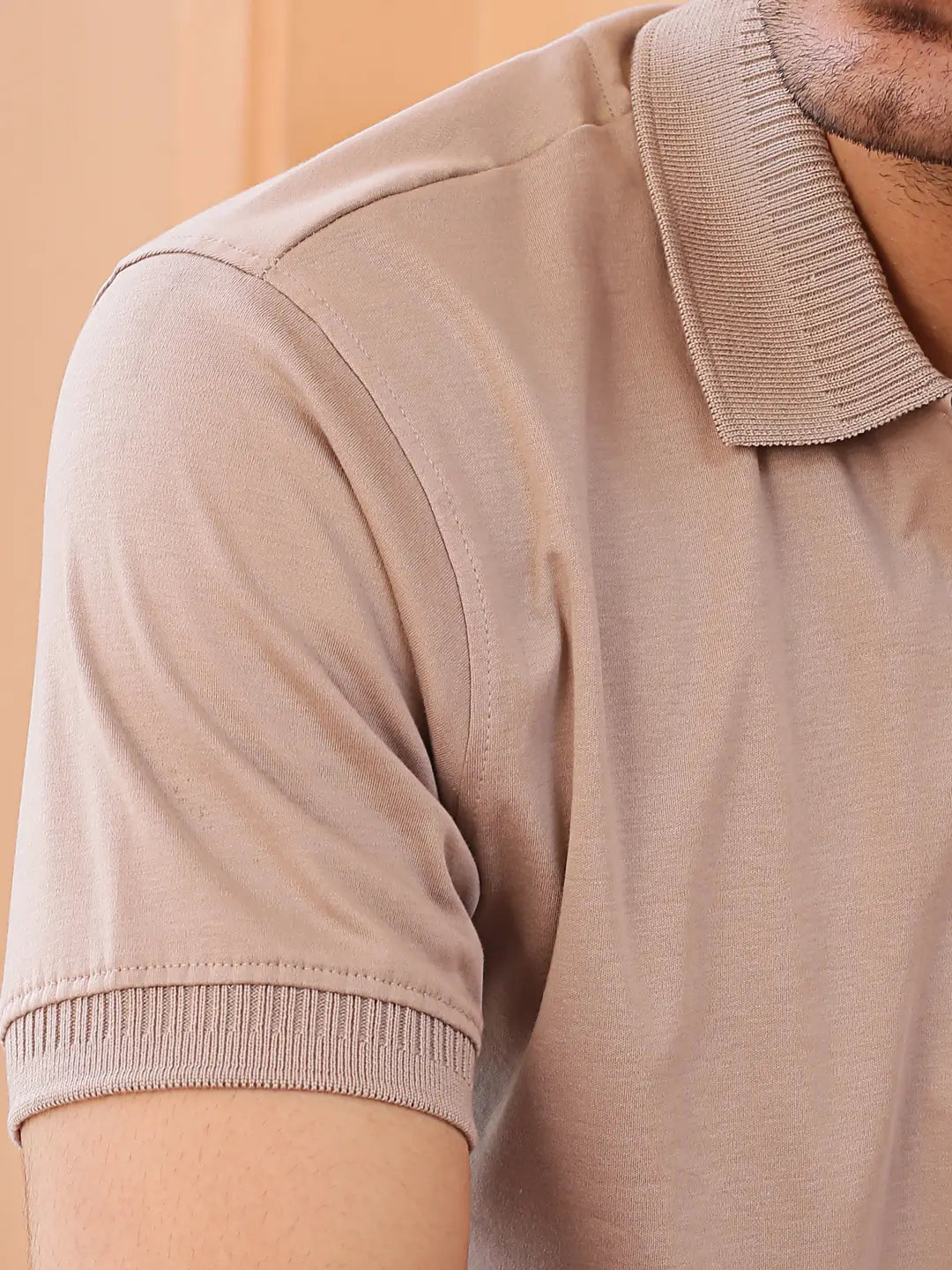 Close-up of a beige polo shirt