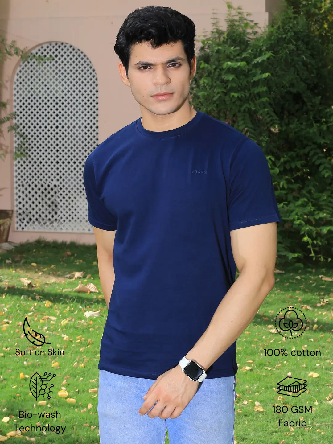 Man wearing a navy blue crew neck t-shirt