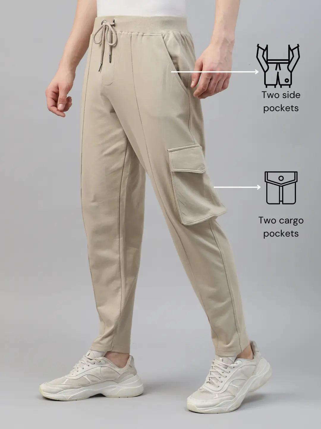 Beige cargo pants with side and cargo pockets on a gray background