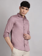 Man wearing a solid button-up shirt